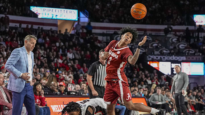 Mar 3, 2026; Athens, Georgia, USA; Alabama Crimson Tide guard Aden Holloway (2) goes after a loose ball over Georgia Bulldogs guard Jeremiah Wilkinson (5) at Stegeman Coliseum. Mandatory Credit: Dale Zanine-Imagn Images