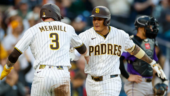Apr 11, 2026; San Diego, California, USA; San Diego Padres third baseman Manny Machado (13) celebrates with  center fielder Jackson Merrill (3) after hitting a two-run home run during the third inning against the Colorado Rockies  at Petco Park. Mandatory Credit: David Frerker-Imagn Images