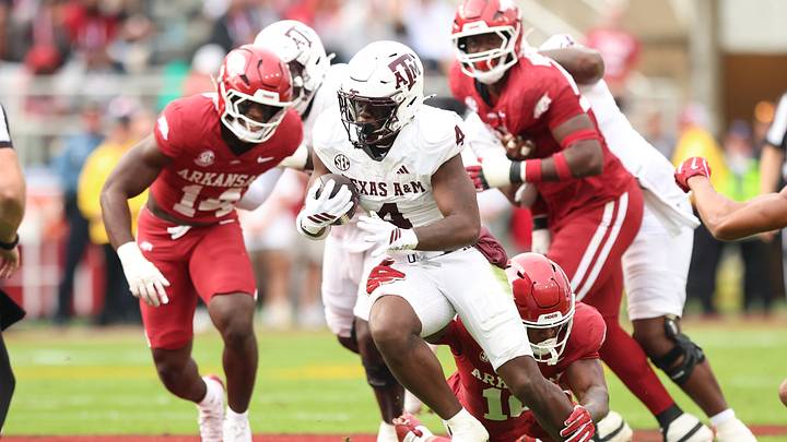 Texas A&M Aggies running back Rueben Owens II (4) rushes in in the first quarter against the Arkansas Razorbacks at Donald W. Reynolds Razorback Stadium. Texas A&M Aggies running back Rueben Owens II (4) rushes in in the first quarter against the Arkansas Razorbacks at Donald W. Reynolds Razorback Stadium.