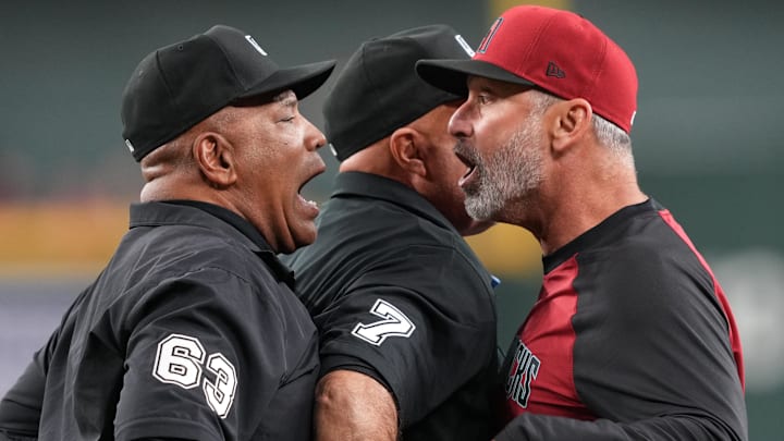 Apr 8, 2025; Phoenix, Arizona, USA; Arizona Diamondbacks manager Torey Lovullo (17) argues with first base umpire Laz Diaz (63) during the seventh inning after being thrown out of the game against the Baltimore Orioles as third base umpire Brian O'Nora (7) attempts the separate the two at Chase Field. Mandatory Credit: Joe Camporeale-Imagn Images Apr 8, 2025; Phoenix, Arizona, USA; Arizona Diamondbacks manager Torey Lovullo (17) argues with first base umpire Laz Diaz (63) during the seventh inning after being thrown out of the game against the Baltimore Orioles as third base umpire Brian O'Nora (7) attempts the separate the two at Chase Field. Mandatory Credit: Joe Camporeale-Imagn Images