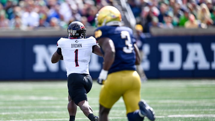 Sep 7, 2024; South Bend, Indiana, USA; Northern Illinois Huskies running back Antario Brown (1) catches a pass for a touchdown as Notre Dame Fighting Irish linebacker Jaylen Sneed (3) pursues in the first quarter at Notre Dame Stadium
