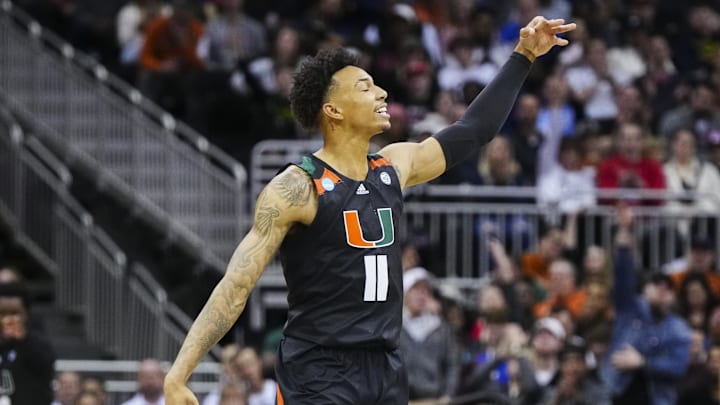 Mar 24, 2023; Kansas City, MO, USA; Miami Hurricanes guard Jordan Miller (11) celebrates after a 3-pointer during the second half of an NCAA tournament Midwest Regional semifinal against the Houston Cougars at T-Mobile Center. Mandatory Credit: Jay Biggerstaff-USA TODAY Sports