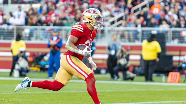 Dec 8, 2024; Santa Clara, California, USA; San Francisco 49ers running back Isaac Guerendo (31) runs in a touchdown during the fourth quarter against the Chicago Bears at Levi's Stadium. Mandatory Credit: Bob Kupbens-Imagn Images