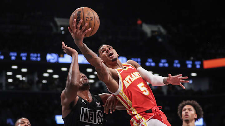 Feb 29, 2024; Brooklyn, New York, USA; Atlanta Hawks guard Dejounte Murray (5) moves past Brooklyn Nets center Day'Ron Sharpe (20) in the fourth quarter at Barclays Center. Mandatory Credit: Wendell Cruz-USA TODAY Sports Feb 29, 2024; Brooklyn, New York, USA; Atlanta Hawks guard Dejounte Murray (5) moves past Brooklyn Nets center Day'Ron Sharpe (20) in the fourth quarter at Barclays Center. Mandatory Credit: Wendell Cruz-USA TODAY Sports