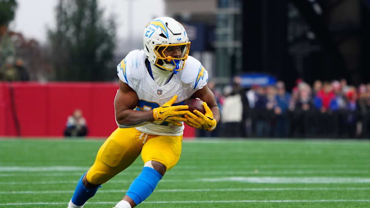 Dec 28, 2024; Foxborough, Massachusetts, USA; Los Angeles Chargers running back J.K. Dobbins (27) runs with the ball after making a catch against the New England Patriots during the first half at Gillette Stadium. Mandatory Credit: Gregory Fisher-Imagn Images