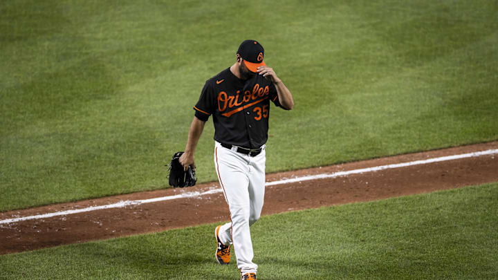 Jul 24, 2021; Baltimore, Maryland, USA; Baltimore Orioles relief pitcher Adam Plutko (35) heads to the dugout during the game against the Washington Nationals at Oriole Park at Camden Yards. Mandatory Credit: Scott Taetsch-Imagn Images