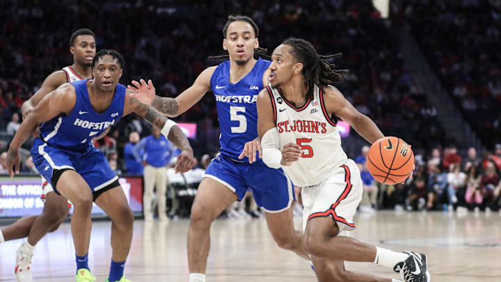 Dec 30, 2023; Elmont, New York, USA;  St. John's Red Storm guard Daniss Jenkins (5) drives past