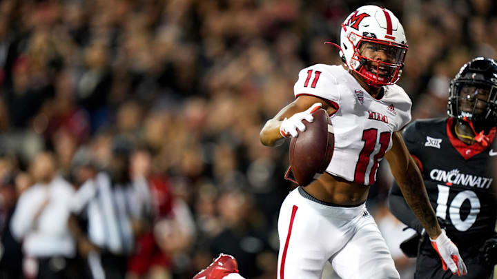 Miami (Oh) RedHawks wide receiver Javon Tracy (11) makes a touchdown during the NCAA football game between the Cincinnati Bearcats and the Miami RedHawks at Nippert Stadium in Cincinnati on Saturday, Sept. 16, 2023. Miami (Oh) RedHawks wide receiver Javon Tracy (11) makes a touchdown during the NCAA football game between the Cincinnati Bearcats and the Miami RedHawks at Nippert Stadium in Cincinnati on Saturday, Sept. 16, 2023.
