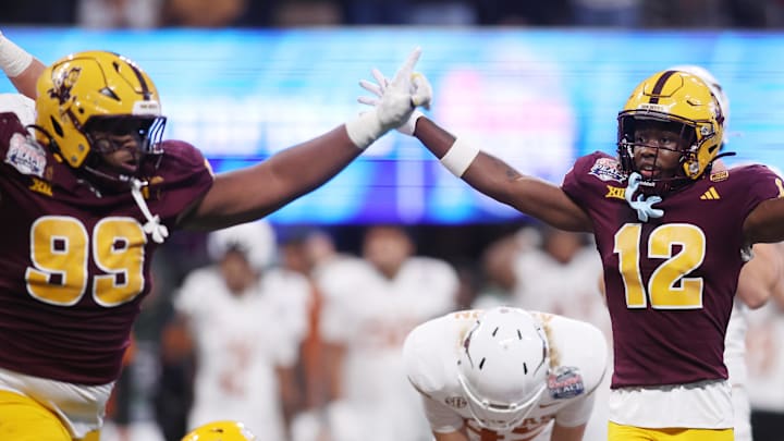 Jan 1, 2025; Atlanta, GA, USA; Arizona State Sun Devils defensive lineman C.J. Fite (99) and defensive back Javan Robinson (12) react after a play against the Texas Longhorns during the second half of the Peach Bowl at Mercedes-Benz Stadium. Mandatory Credit: Brett Davis-Imagn Images
