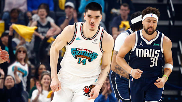 Memphis Grizzlies center Zach Edey (14) reacts after a basket 