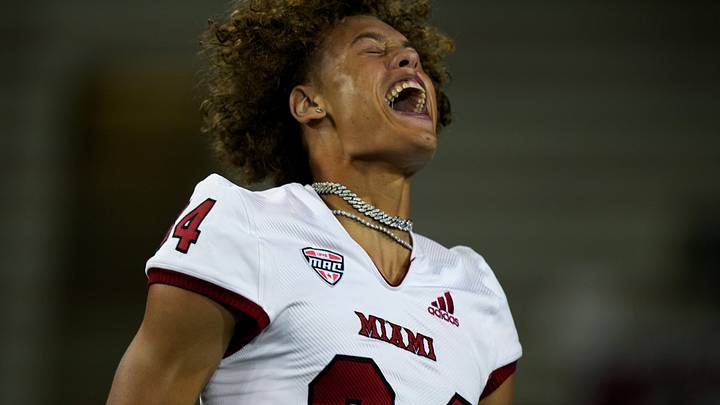 Miami (Oh) RedHawks wide receiver Cole Weaver (84) cheers on the field after the NCAA football game between the Cincinnati Bearcats and the Miami RedHawks at Nippert Stadium in Cincinnati on Saturday, Sept. 16, 2023. Miami (Oh) won 31-24. Miami (Oh) RedHawks wide receiver Cole Weaver (84) cheers on the field after the NCAA football game between the Cincinnati Bearcats and the Miami RedHawks at Nippert Stadium in Cincinnati on Saturday, Sept. 16, 2023. Miami (Oh) won 31-24.