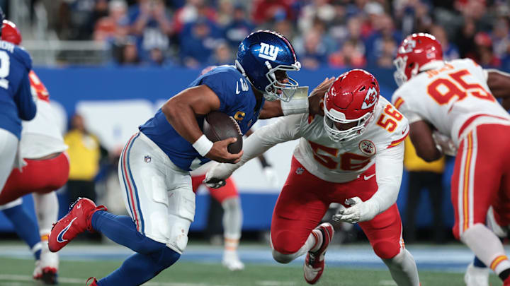 Sep 21, 2025; East Rutherford, New Jersey, USA; New York Giants quarterback Russell Wilson (3) runs against Kansas City Chiefs defensive end George Karlaftis (56) in the fourth quarter at MetLife Stadium. Mandatory Credit: Vincent Carchietta-Imagn Images