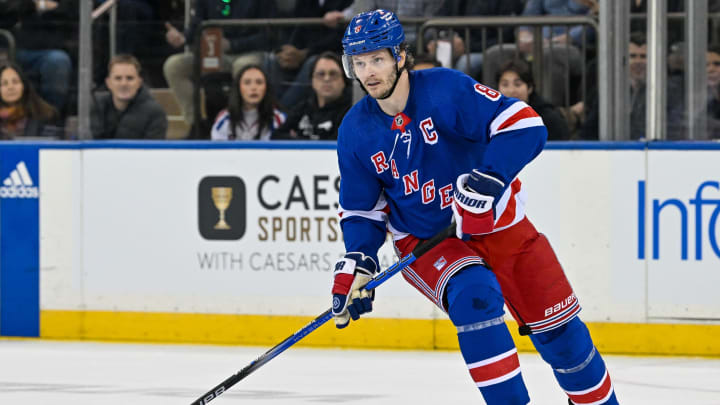 Apr 23, 2024; New York, New York, USA; New York Rangers defenseman Jacob Trouba (8) skates with the puck against the Washington Capitals during the first period in game two of the first round of the 2024 Stanley Cup Playoffs at Madison Square Garden. Mandatory Credit: Dennis Schneidler-USA TODAY Sports Apr 23, 2024; New York, New York, USA; New York Rangers defenseman Jacob Trouba (8) skates with the puck against the Washington Capitals during the first period in game two of the first round of the 2024 Stanley Cup Playoffs at Madison Square Garden. Mandatory Credit: Dennis Schneidler-USA TODAY Sports