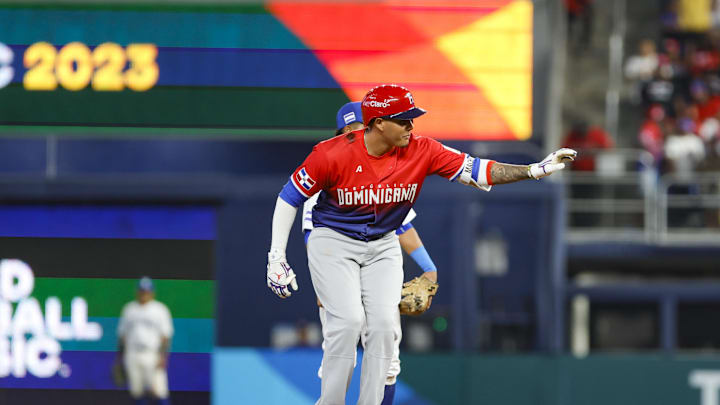 Mar 13, 2023; Miami, Florida, USA; Dominican Republic third baseman Manny Machado (13) reacts from second base after hitting a double during the ninth inning against Nicaragua at LoanDepot Park. 