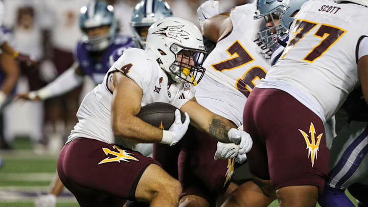 Nov 16, 2024; Manhattan, Kansas, USA; Arizona State Sun Devils running back Cam Skattebo (4) carries the ball against the Kansas State Wildcats during the second quarter at Bill Snyder Family Football Stadium. Mandatory Credit: Scott Sewell-Imagn Images