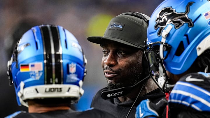 Detroit Lions assistant head coach and wide receivers coach Scottie Montgomery, center, talks to receivers Amon-Ra St. Brown and Jameson Williams before a play against the New York Giants during the first half at Ford Field in Detroit on Sunday, Nov. 23, 2025. Detroit Lions assistant head coach and wide receivers coach Scottie Montgomery, center, talks to receivers Amon-Ra St. Brown and Jameson Williams before a play against the New York Giants during the first half at Ford Field in Detroit on Sunday, Nov. 23, 2025.