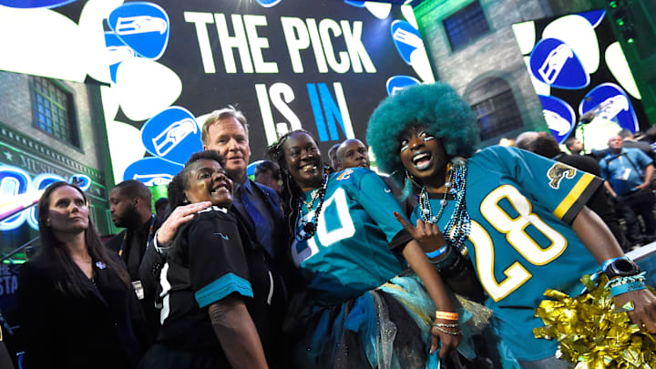 NFL Commisioner Roger Goodell poses with Jaguars fans during the first round of the NFL Draft Thursday, April 25, 2019, in Nashville, Tenn.