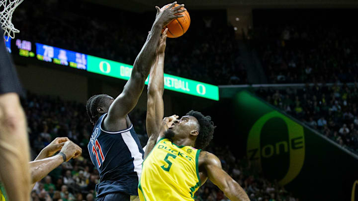 Arizona center Oumar Ballo blocks a shot by Oregon guard Jermaine Couisnard as the Oregon Ducks host the Arizona Wildcats.
