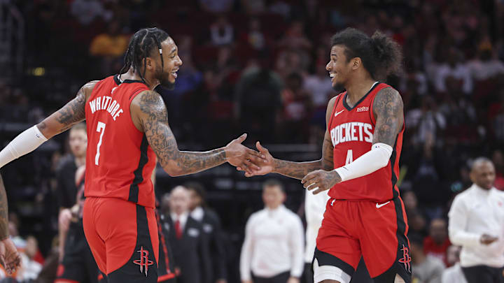 Feb 9, 2025; Houston, Texas, USA; Houston Rockets forward Cam Whitmore (7) and guard Jalen Green (4) celebrate after a play during the fourth quarter against the Toronto Raptors at Toyota Center. Mandatory Credit: Troy Taormina-Imagn Images
