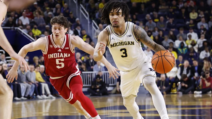 Elliot Cadeau drives against an Indiana defender