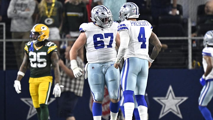 Sep 28, 2025; Arlington, Texas, USA; Dallas Cowboys quarterback Dak Prescott (4) celebrates with center Brock Hoffman (67) after a touchdown in the second quarter against the Green Bay Packers at AT&T Stadium. Mandatory Credit: Jerome Miron-Imagn Images