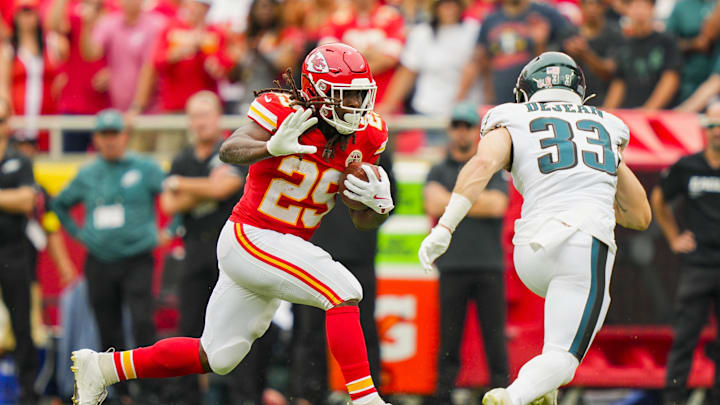 Sep 14, 2025; Kansas City, Missouri, USA; Kansas City Chiefs running back Kareem Hunt (29) runs the ball against Philadelphia Eagles cornerback Cooper DeJean (33) during the first half at GEHA Field at Arrowhead Stadium. Mandatory Credit: Jay Biggerstaff-Imagn Images