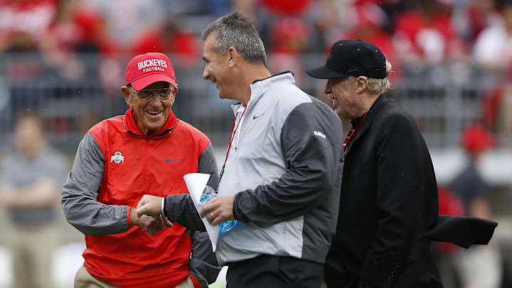 Apr 15, 2017; Columbus, OH, USA; Ohio State Buckeyes  head coach Urban Meyer (center), Lou Holtz, (left), and Nike founder Phil Knight prior to the annual spring game at Ohio Stadium. Mandatory Credit: Joe Maiorana-Imagn Images