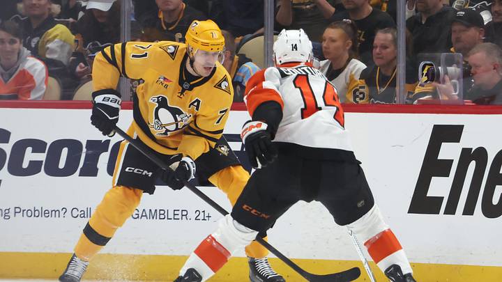 Apr 20, 2026; Pittsburgh, Pennsylvania, USA;  Pittsburgh Penguins center Evgeni Malkin (71) handles the puck against  Philadelphia Flyers center Sean Couturier (14) during the second period in game two of the first round of the 2026 Stanley Cup Playoffs at PPG Paints Arena. Mandatory Credit: Charles LeClaire-Imagn Images