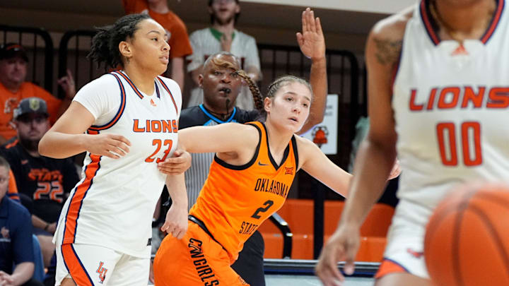 Oklahoma State's Lena Girardi (2) reacts after a 3-point basket next to Langston's Laula Curry during the college basketball game between the Oklahoma State Cowgirls and the Langston Lions at Gallagher-Iba Arena, Okla., Thursday Nov., 6, 2025.