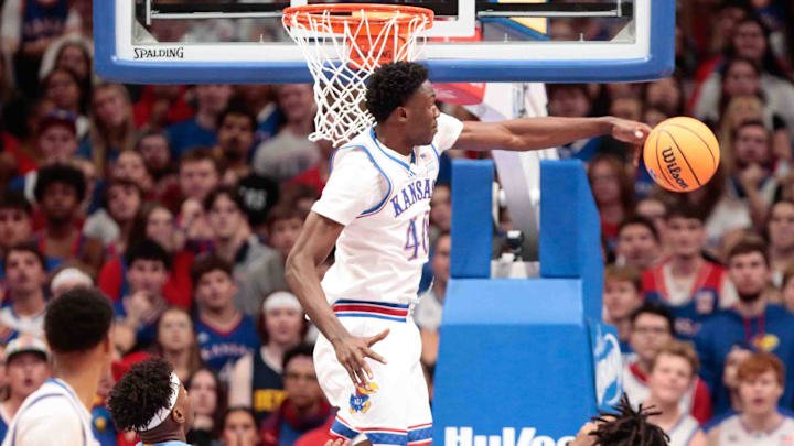 Kansas Jayhawks forward Flory Bidunga (40) blocks a shot against North Carolina Tar Heels guard Elliot Cadeau (3) in the first half of the game inside Allen Fieldhouse Friday, Nov. 8, 2024.
