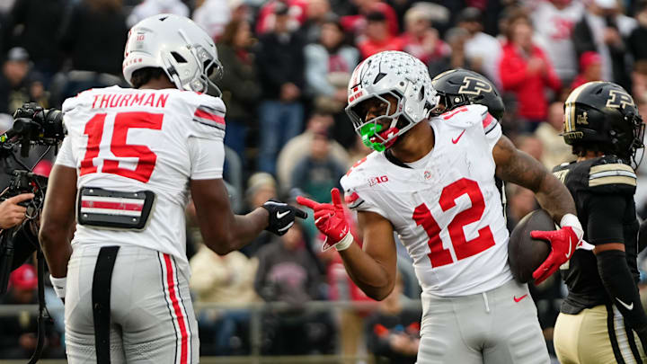 Ohio State Buckeyes running back CJ Donaldson Jr. (12) celebrates a touchdown with tight end Jelani Thurman (15) during the NCAA football game against the Purdue Boilermakers at Ross-Ade Stadium in West Lafayette, Ind. on Nov. 8, 2025. Ohio State won 34-10.