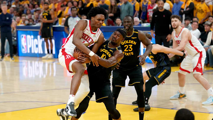 May 2, 2025; San Francisco, California, USA; Golden State Warriors forward Jimmy Butler III (10) forces a jump ball while defending Houston Rockets forward Amen Thompson (1) in the fourth quarter of game six of the first round for the 2025 NBA Playoffs at Chase Center. Mandatory Credit: Cary Edmondson-Imagn Images May 2, 2025; San Francisco, California, USA; Golden State Warriors forward Jimmy Butler III (10) forces a jump ball while defending Houston Rockets forward Amen Thompson (1) in the fourth quarter of game six of the first round for the 2025 NBA Playoffs at Chase Center. Mandatory Credit: Cary Edmondson-Imagn Images