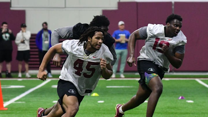 Florida State football players Lamont Green Jr. (45) and Tomiwa Durojaiye (19) take part in the final Tour of Duty winter workouts ahead of 2024 spring practices on Thursday, March 7, 2024.