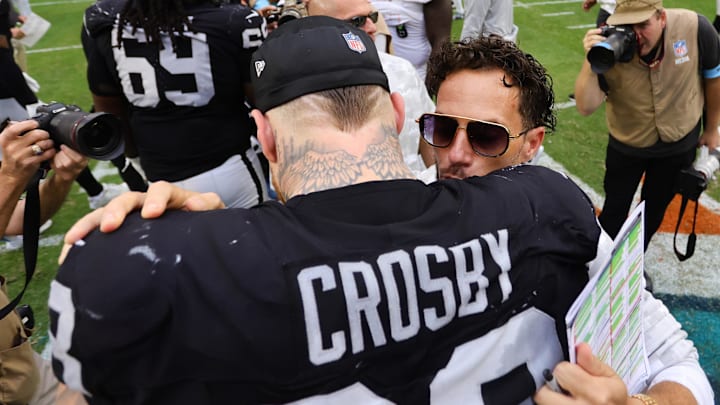 Nov 17, 2024; Miami Gardens, Florida, USA; Miami Dolphins head coach Mike McDaniel and Las Vegas Raiders defensive end Maxx Crosby (98) hug after the game at Hard Rock Stadium. Mandatory Credit: Sam Navarro-Imagn Images Nov 17, 2024; Miami Gardens, Florida, USA; Miami Dolphins head coach Mike McDaniel and Las Vegas Raiders defensive end Maxx Crosby (98) hug after the game at Hard Rock Stadium. Mandatory Credit: Sam Navarro-Imagn Images