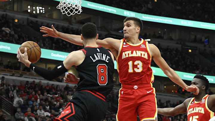 Apr 4, 2023; Chicago, Illinois, USA; Atlanta Hawks guard Bogdan Bogdanovic (13) defends against Chicago Bulls guard Zach LaVine (8) during the first half at the United Center. Mandatory Credit: Matt Marton-USA TODAY Sports Apr 4, 2023; Chicago, Illinois, USA; Atlanta Hawks guard Bogdan Bogdanovic (13) defends against Chicago Bulls guard Zach LaVine (8) during the first half at the United Center. Mandatory Credit: Matt Marton-USA TODAY Sports