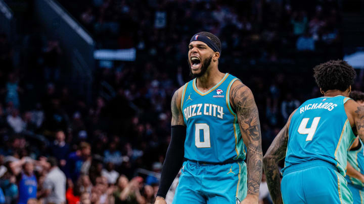 Apr 7, 2024; Charlotte, North Carolina, USA; Charlotte Hornets forward Miles Bridges (0) celebrates after scoring against the Oklahoma City Thunder during the fourth quarter at Spectrum Center. Mandatory Credit: Scott Kinser-USA TODAY Sports