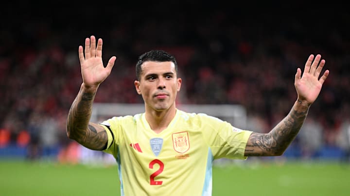 Pedro Porro acknowledges the travelling Spanish fans after the game 