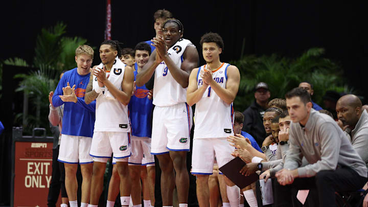 Nov 29, 2024; Orlando, Florida, USA; Florida Gators center Rueben Chinyelu (9) and guard Walter Clayton Jr. (1) react after a play against the Wichita State Shockers in the second half at ESPN Wide World of Sports Complex. Mandatory Credit: Nathan Ray Seebeck-Imagn Images
