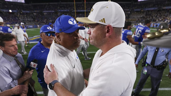 Dec 27, 2025; Orlando, FL, USA; BYU Cougars head coach Kalani Sitake greets Georgia Tech Yellow Jackets head coach Brent Key after the Pop-Tarts Bowl at Camping World Stadium. Mandatory Credit: Nathan Ray Seebeck-Imagn Images