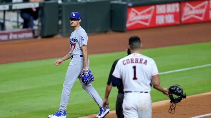 Jul 28, 2020; Houston, Texas, USA; Los Angeles Dodgers relief pitcher Joe Kelly (17) continues to shout at Houston Astros shortstop Carlos Correa (1) after a strikeout during the sixth inning at Minute Maid Park. Mandatory Credit: Erik Williams-Imagn Images Jul 28, 2020; Houston, Texas, USA; Los Angeles Dodgers relief pitcher Joe Kelly (17) continues to shout at Houston Astros shortstop Carlos Correa (1) after a strikeout during the sixth inning at Minute Maid Park. Mandatory Credit: Erik Williams-Imagn Images