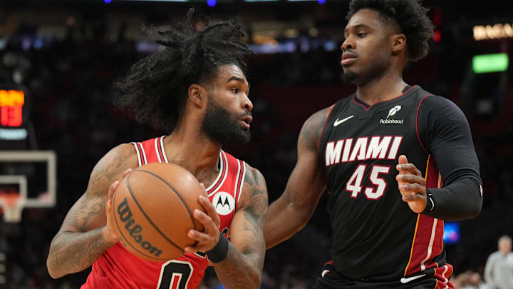 Feb 1, 2026; Miami, Florida, USA; Chicago Bulls guard Coby White (0) looks to pass as Miami Heat guard Davion Mitchell (45) defends during the first half at Kaseya Center. Mandatory Credit: Jim Rassol-Imagn Images Feb 1, 2026; Miami, Florida, USA; Chicago Bulls guard Coby White (0) looks to pass as Miami Heat guard Davion Mitchell (45) defends during the first half at Kaseya Center. Mandatory Credit: Jim Rassol-Imagn Images