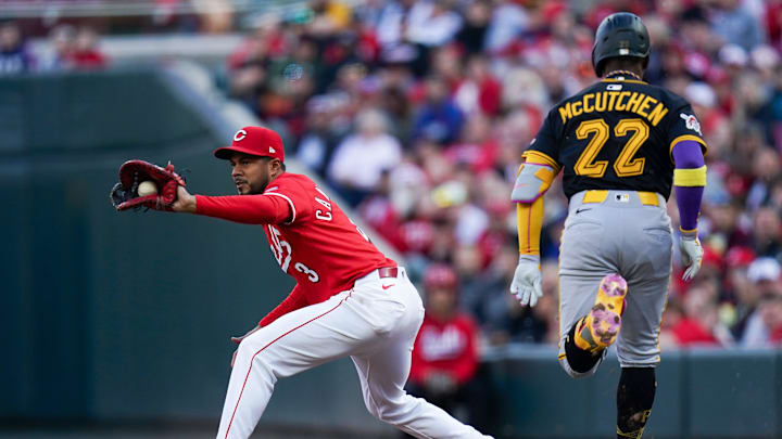 Cincinnati Reds first base Jeimer Candelario (3) tags out Pittsburgh Pirates outfielder Andrew McCutchen (22) in the second inning of a MLB game between the Cincinnati Reds and Pittsburgh Pirates, Saturday, April 12, 2025, at Great American Ball Park in Downtown Cincinnati.