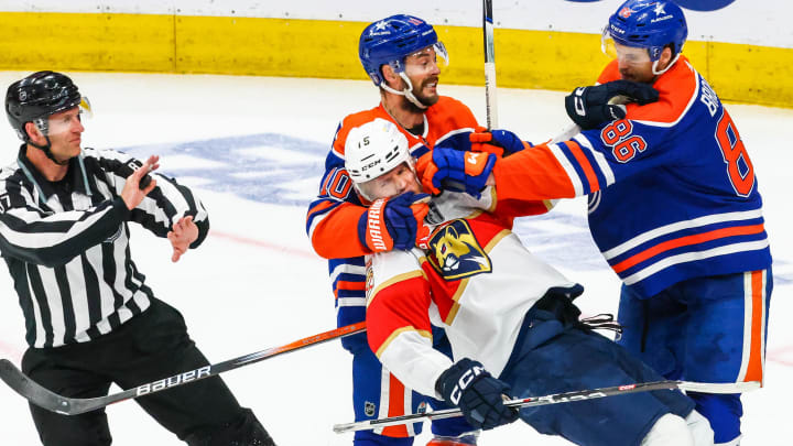 Jun 15, 2024; Edmonton, Alberta, CAN; Edmonton Oilers center Derek Ryan (10) and Florida Panthers center Anton Lundell (15) gets into a scrum during the third period in game four of the 2024 Stanley Cup Final at Rogers Place. Mandatory Credit: Sergei Belski-USA TODAY Sports