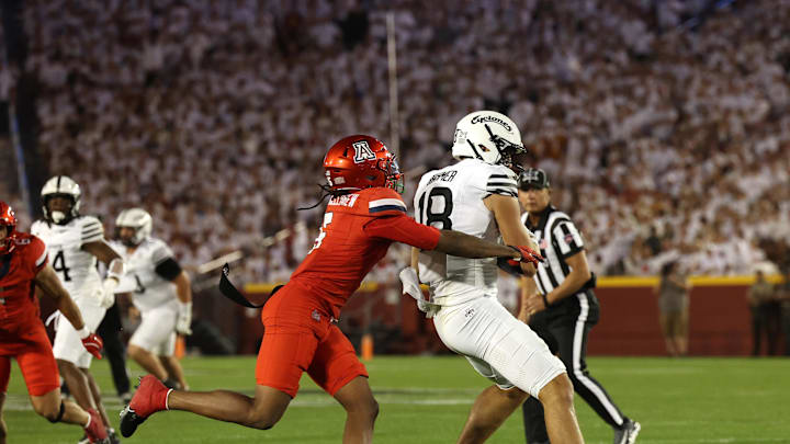 Sep 27, 2025; Ames, Iowa, USA; Iowa State Cyclones tight end Benjamin Brahmer (18) catches a pass in front of Arizona Wildcats defensive back Marquis Groves-Killebrew (5) during the first half at Jack Trice Stadium. Mandatory Credit: Reese Strickland-Imagn Images