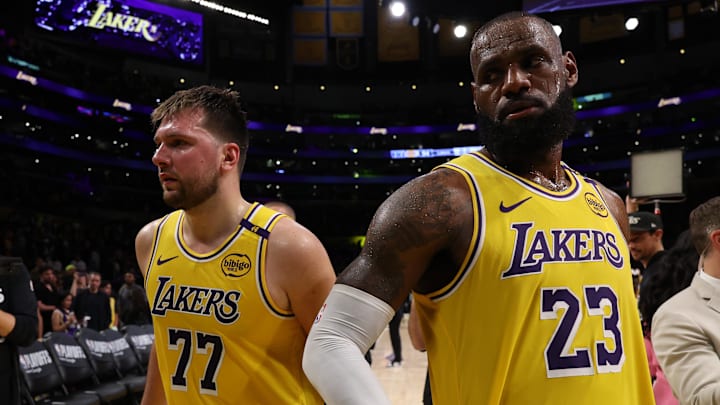 Apr 22, 2025; Los Angeles, California, USA; Los Angeles Lakers guard Luka Doncic (77) and Los Angeles Lakers forward LeBron James (23) leave a court after defeating the Minnesota Timberwolves 94-85 in game two of first round for the 2024 NBA Playoffs at Crypto.com Arena. Mandatory Credit: Kiyoshi Mio-Imagn Images
