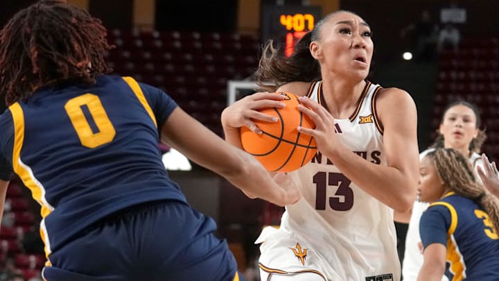 ASU Sun Devils guard Last-Tear Poa (13) drives into the lane as Coppin State Bald Eagles guard Skylar Barnes (5) defends at Desert Financial Arena on Nov. 3, 2025.