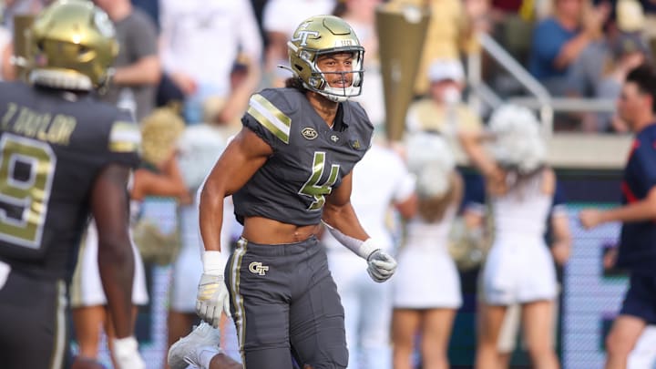 Sep 20, 2025; Atlanta, Georgia, USA; Georgia Tech Yellow Jackets wide receiver Isiah Canion (4) celebrates after a touchdown catch against the Temple Owls in the first quarter at Bobby Dodd Stadium at Hyundai Field. Mandatory Credit: Brett Davis-Imagn Images
