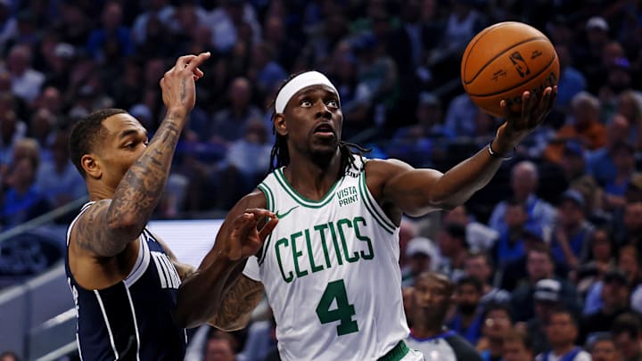 Jun 14, 2024; Dallas, Texas, USA; Boston Celtics guard Jrue Holiday (4) shoots the ball against Dallas Mavericks forward P.J. Washington (25) during game four of the 2024 NBA Finals at American Airlines Center. Mandatory Credit: Peter Casey-Imagn Images Jun 14, 2024; Dallas, Texas, USA; Boston Celtics guard Jrue Holiday (4) shoots the ball against Dallas Mavericks forward P.J. Washington (25) during game four of the 2024 NBA Finals at American Airlines Center. Mandatory Credit: Peter Casey-Imagn Images