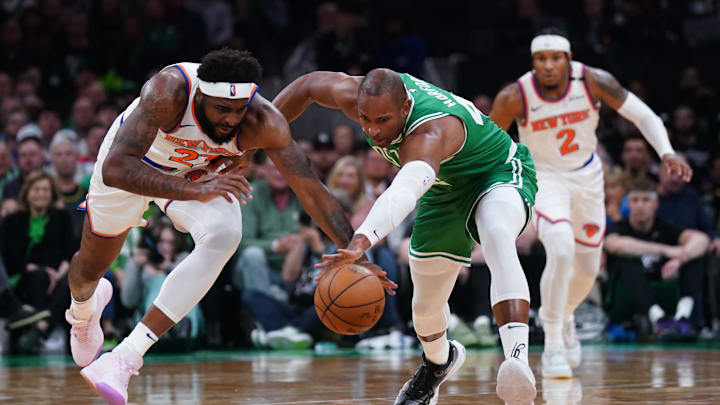 May 7, 2025; Boston, Massachusetts, USA; New York Knicks center Mitchell Robinson (23) works for the ball against Boston Celtics center Al Horford (42) in the second quarter during game two of the second round for the 2025 NBA Playoffs at TD Garden. Mandatory Credit: David Butler II-Imagn Images
