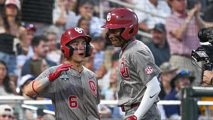 Oklahoma Sooners right fielder Dasan Harris (17) celebrates with second baseman Kyle Branch (6) after hitting a home run against the Georgia Bulldogs during the eighth inning at Charles Schwab Field. 